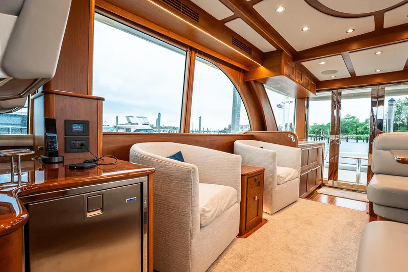  Yacht Photos Pics Luxurious interior of 2024 Sabre 58 Salon Express yacht with elegant seating and wood finishes.