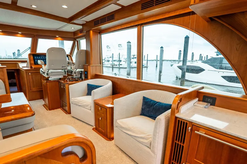  Yacht Photos Pics Luxurious interior of 2024 Sabre 58 Salon Express yacht with plush seating and large windows.