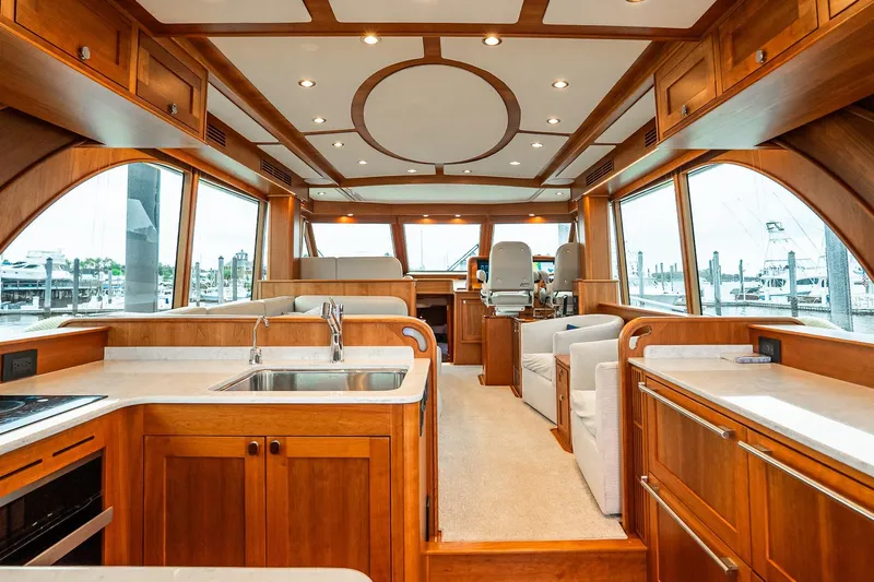  Yacht Photos Pics Luxurious interior of 2024 Sabre 58 Salon Express yacht with elegant wood finishes.