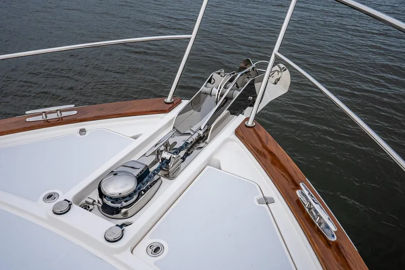  Yacht Photos Pics Bow of 2024 Sabre 58 Salon Express yacht with anchor and polished wood details.