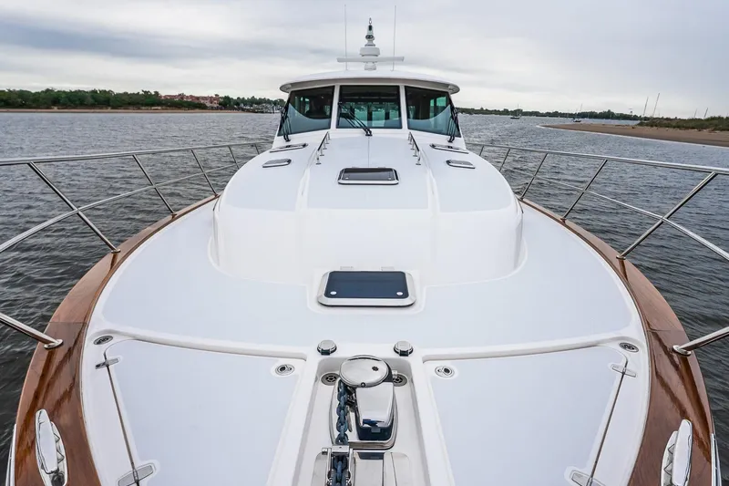  Yacht Photos Pics 2024 Sabre 58 Salon Express yacht on open water, showcasing sleek deck design.