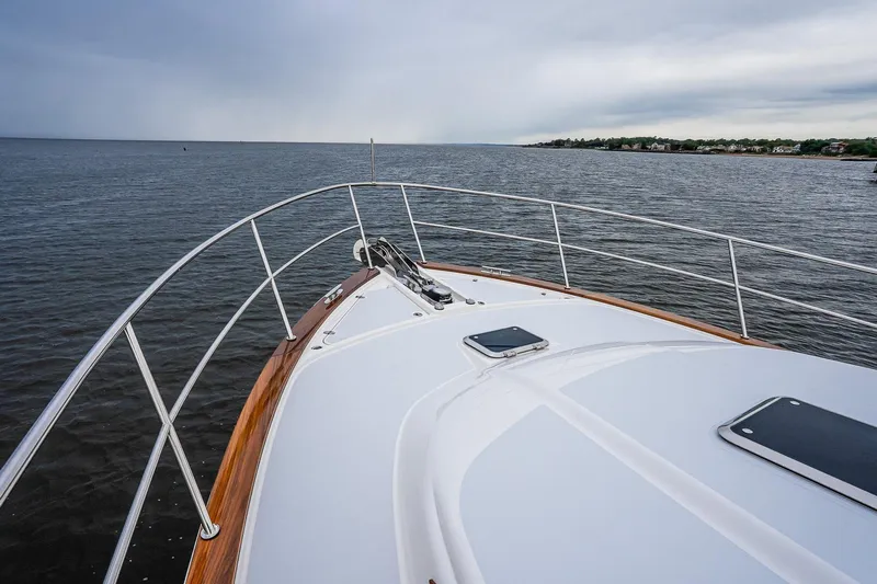  Yacht Photos Pics Bow view of 2024 Sabre 58 Salon Express yacht on open water.