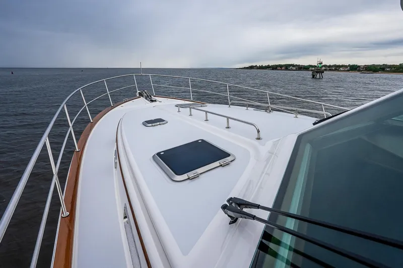  Yacht Photos Pics 2024 Sabre 58 Salon Express yacht on open water, showcasing sleek deck design.