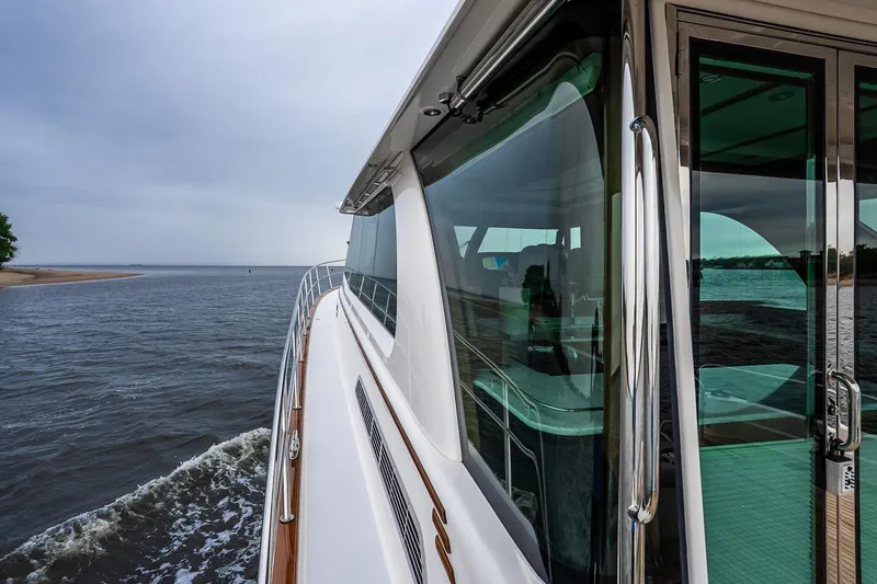  Yacht Photos Pics 2024 Sabre 58 Salon Express yacht cruising on open water, showcasing sleek design.