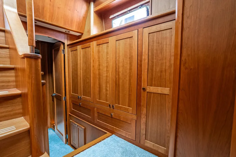  Yacht Photos Pics Luxurious wooden interior of 2024 Sabre 58 Salon Express yacht with elegant cabinetry.