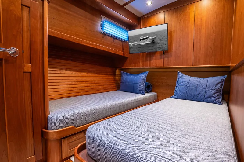  Yacht Photos Pics Twin cabin with wooden interior in 2024 Sabre 58 Salon Express yacht.