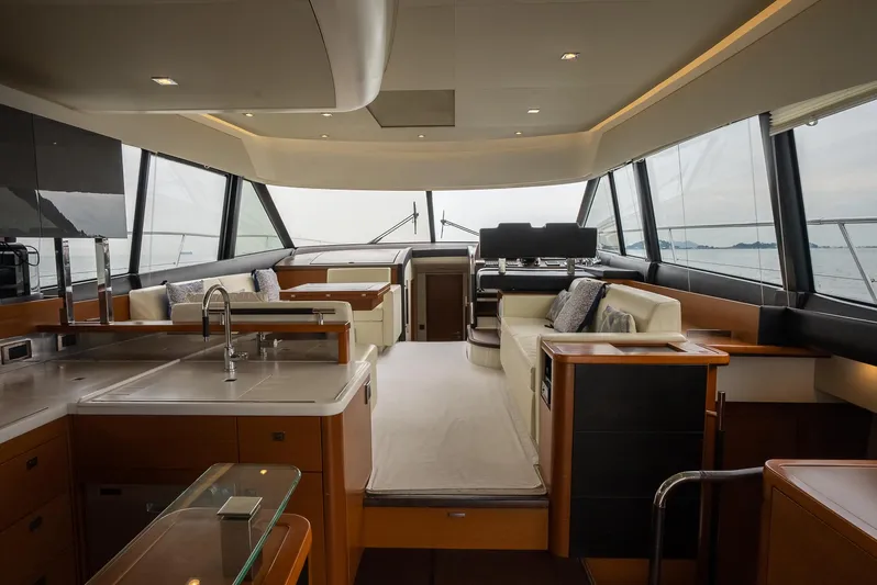 Shanti III Yacht Photos Pics Interior of 2016 Prestige Flybridge yacht with modern kitchen and spacious seating area.