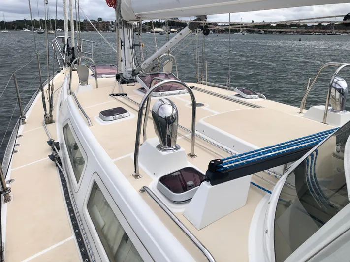 Ibis Yacht Photos Pics Outbound 46 sailboat deck, 2008 model, featuring sleek design and modern fittings on calm waters.