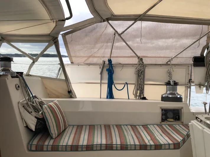 Ibis Yacht Photos Pics 2008 Outbound 46 sailboat cockpit with striped cushions and nautical equipment.