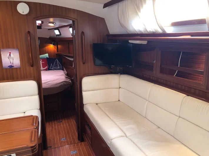 Ibis Yacht Photos Pics Luxurious interior of 2008 Outbound 46 yacht with cozy seating and elegant wood finish.