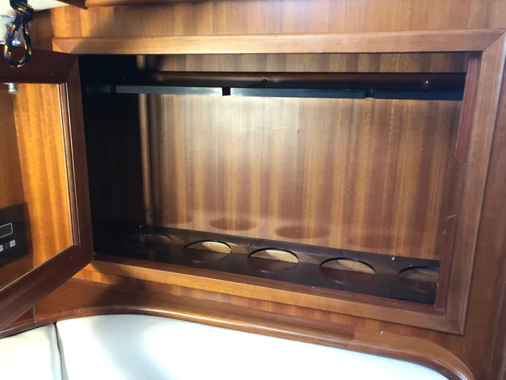 Ibis Yacht Photos Pics Wooden cabinet interior with circular cutouts, part of a 2008 Outbound 46 yacht.