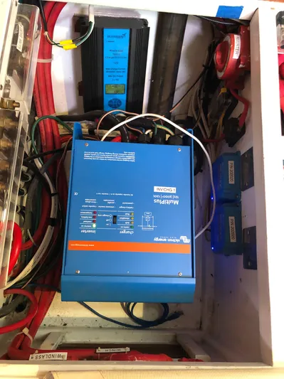 Ibis Yacht Photos Pics Electrical system components in a 2008 Outbound 46 yacht, featuring wiring and a blue inverter.