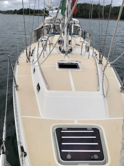 Ibis Yacht Photos Pics Outbound 46 sailboat deck, 2008 model, on calm water with visible rigging and hatches.