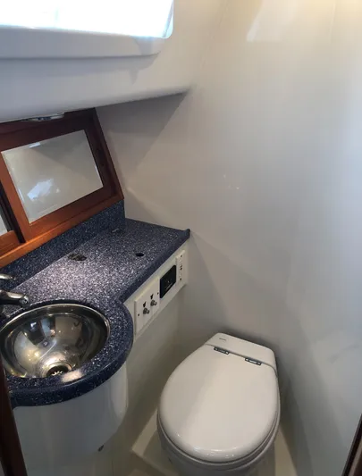 Ibis Yacht Photos Pics Compact bathroom in 2008 Outbound 46 yacht with sink and toilet.