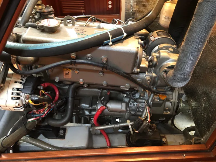 Ibis Yacht Photos Pics Engine compartment of a 2008 Outbound 46 sailboat, showcasing detailed mechanical components.