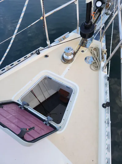 Ibis Yacht Photos Pics Deck of 2008 Outbound 46 sailboat with open hatch and winch.