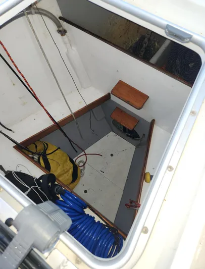 Ibis Yacht Photos Pics View inside a 2008 Outbound 46 sailboat hatch with ropes and equipment.