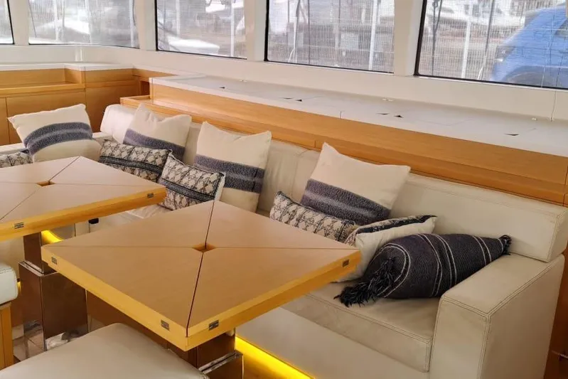 Sicilia Yacht Photos Pics Luxurious interior of 2013 Lagoon 620 yacht with plush seating and elegant decor.