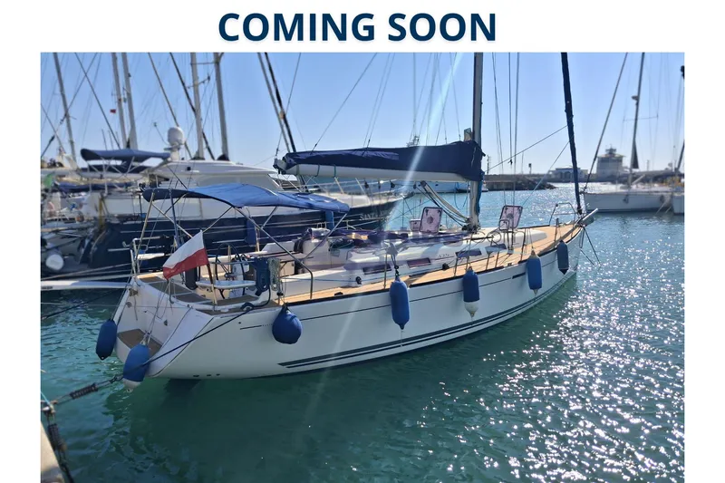  Yacht Photos Pics 2009 Dufour 425 Grand Large sailboat docked in sunny marina, "Coming Soon" text above.