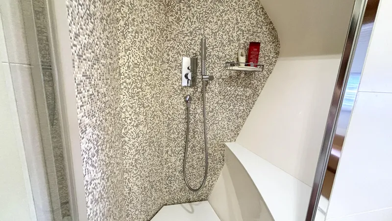 Dolce Vita Yacht Photos Pics Luxurious shower with mosaic tiles in 2011 Pershing 74 yacht bathroom.