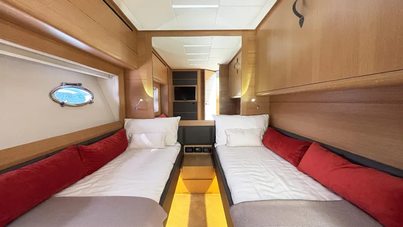 Dolce Vita Yacht Photos Pics Luxurious twin cabin interior of 2011 Pershing 74 yacht with modern wood finish.