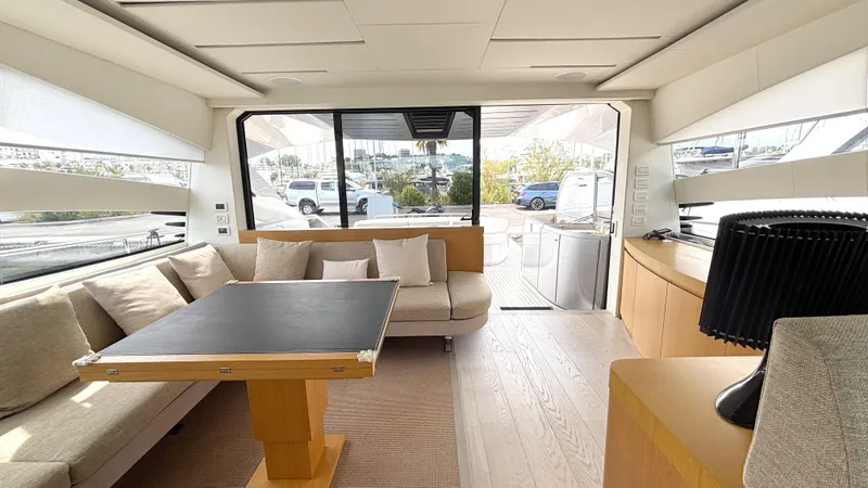 Dolce Vita Yacht Photos Pics Luxurious interior of a 2011 Pershing 74 yacht with modern furnishings and ample natural light.