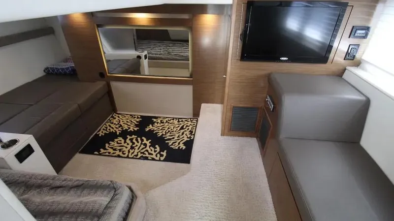 Stella Maris Yacht Photos Pics Luxurious interior of 2016 Cruisers Yachts 45 Cantius with modern furnishings and TV.