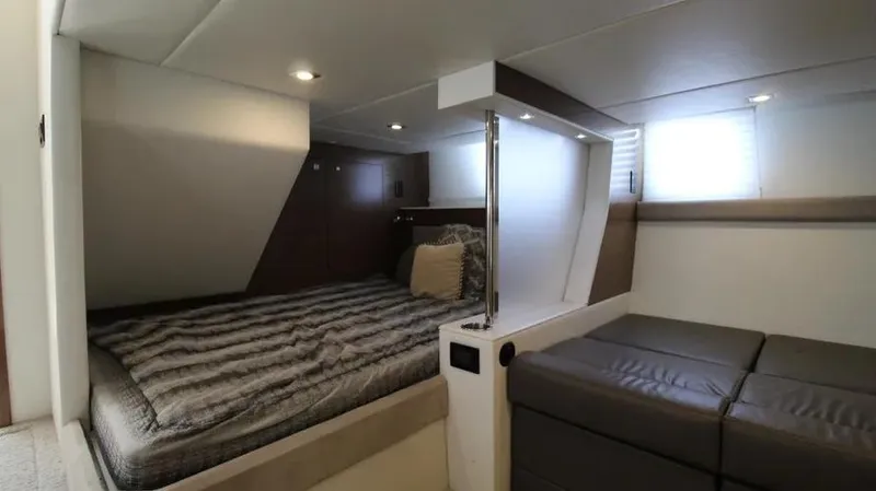 Stella Maris Yacht Photos Pics Luxurious interior of 2016 Cruisers Yachts 45 Cantius with cozy bed and modern design.