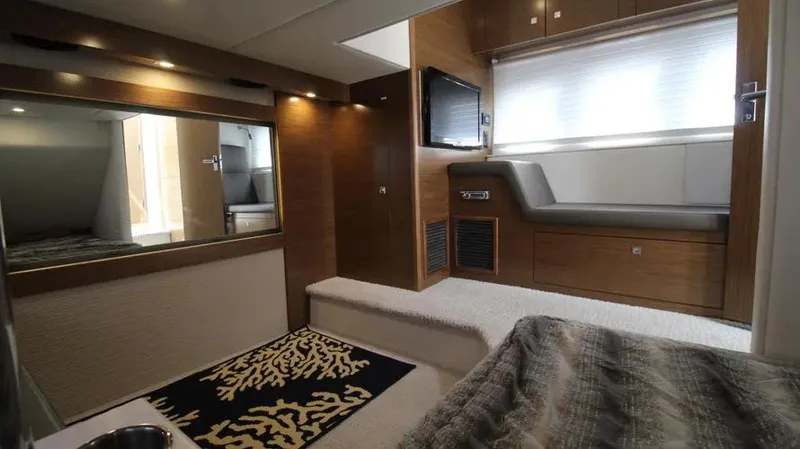 Stella Maris Yacht Photos Pics Luxurious interior of 2016 Cruisers Yachts 45 Cantius with modern furnishings and ambient lighting.