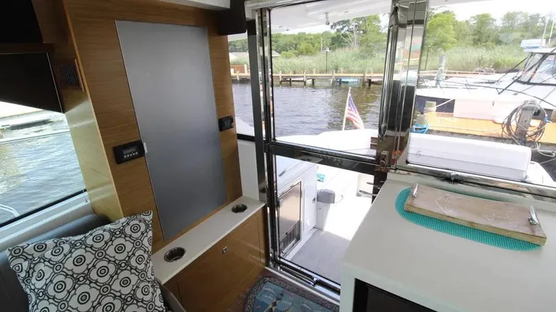 Stella Maris Yacht Photos Pics Interior view of 2016 Cruisers Yachts 45 Cantius, featuring modern design and waterfront backdrop.