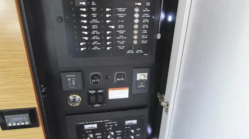 Stella Maris Yacht Photos Pics Electrical panel inside 2016 Cruisers Yachts 45 Cantius, showcasing switches and controls.