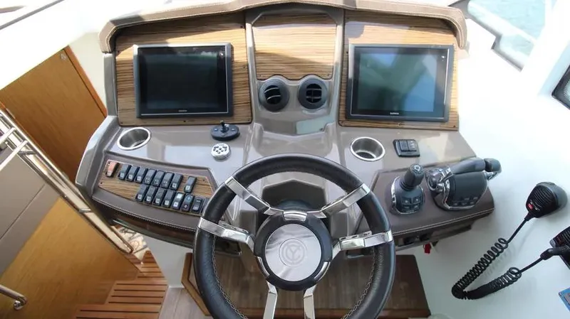 Stella Maris Yacht Photos Pics Helm of 2016 Cruisers Yachts 45 Cantius with dual screens and controls.