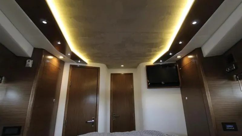 Stella Maris Yacht Photos Pics Luxurious interior of 2016 Cruisers Yachts 45 Cantius with modern lighting and wood finishes.