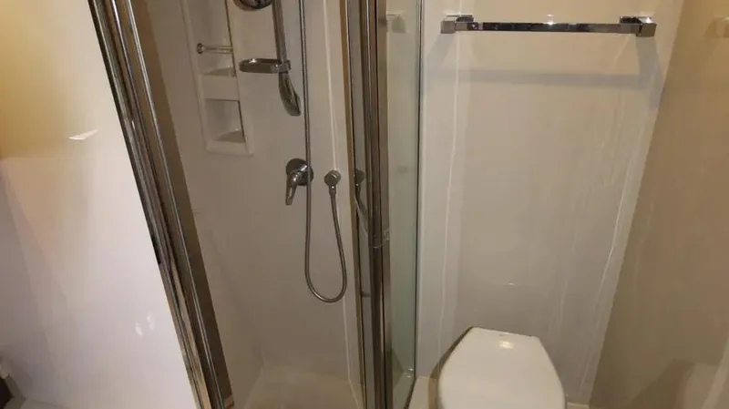 Stella Maris Yacht Photos Pics Bathroom interior of 2016 Cruisers Yachts 45 Cantius with shower and toilet.