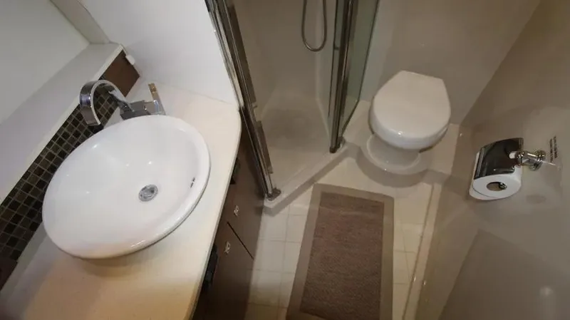 Stella Maris Yacht Photos Pics Modern bathroom in 2016 Cruisers Yachts 45 Cantius with sink, toilet, and shower.