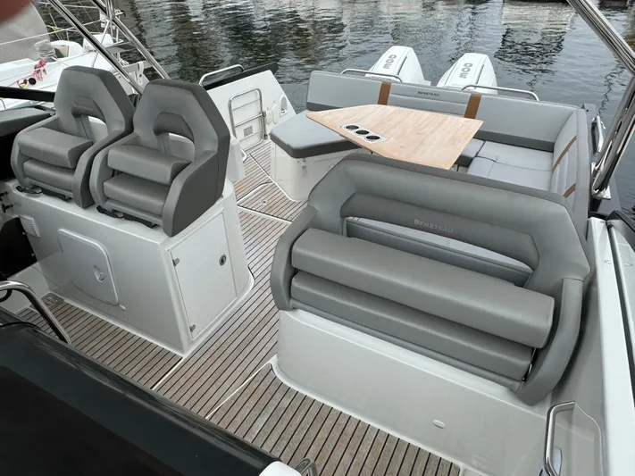 La Bella Vita Yacht Photos Pics Interior of 2020 Beneteau Flyer 10 with gray seating and wooden table.