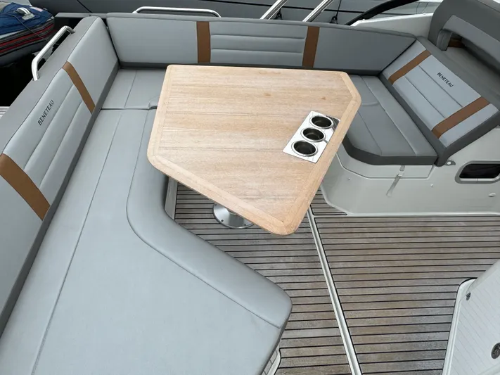 La Bella Vita Yacht Photos Pics Interior of 2020 Beneteau Flyer 10 with gray seating and wooden table.