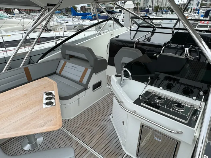 La Bella Vita Yacht Photos Pics 2020 Beneteau Flyer 10 with modern interior and outdoor kitchen.