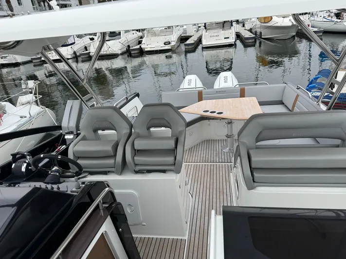 La Bella Vita Yacht Photos Pics Beneteau Flyer 10, 2020, modern boat with sleek interior at the marina.