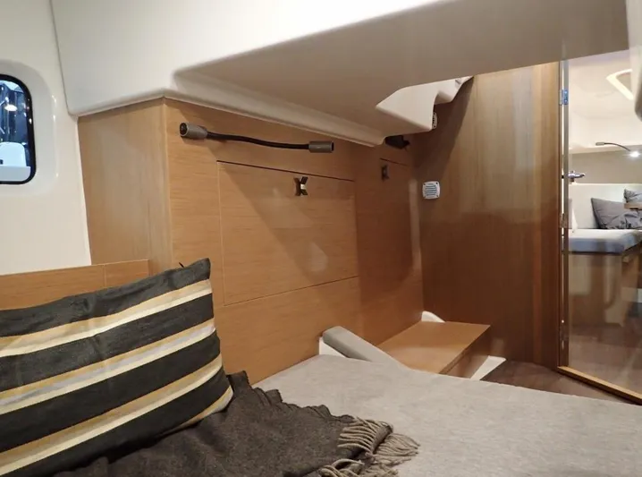La Bella Vita Yacht Photos Pics Interior of 2020 Beneteau Flyer 10 with cozy bed and wooden furnishings.