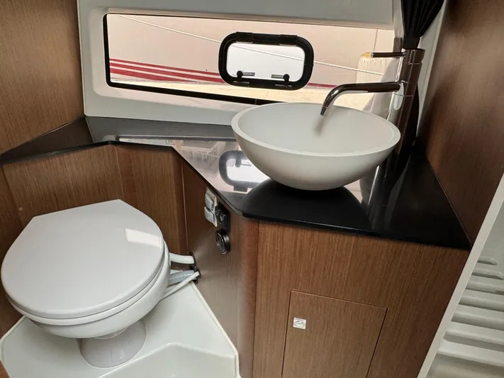 La Bella Vita Yacht Photos Pics Interior of 2020 Beneteau Flyer 10 with toilet and sink.