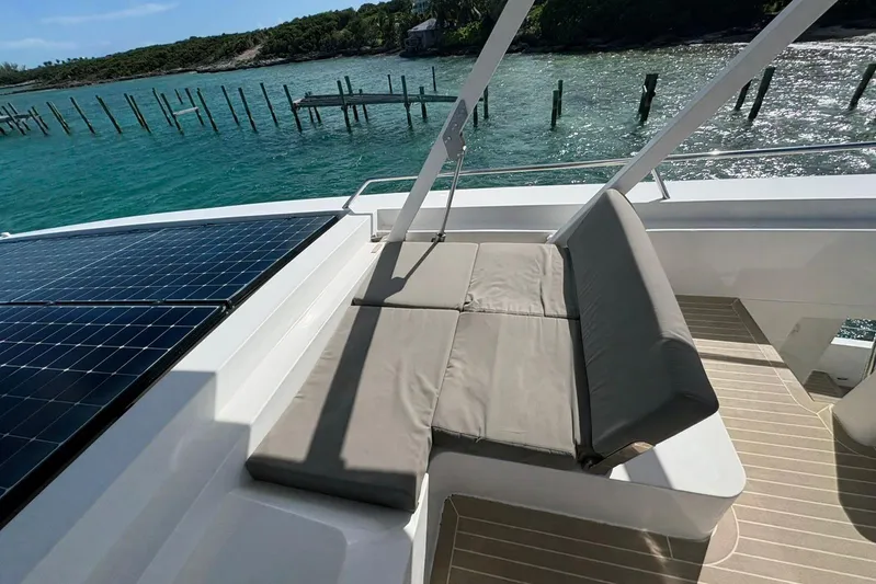 Silent Seven Yacht Photos Pics Luxury Silent 55 yacht deck with solar panels and cushioned seating, 2020 model.
