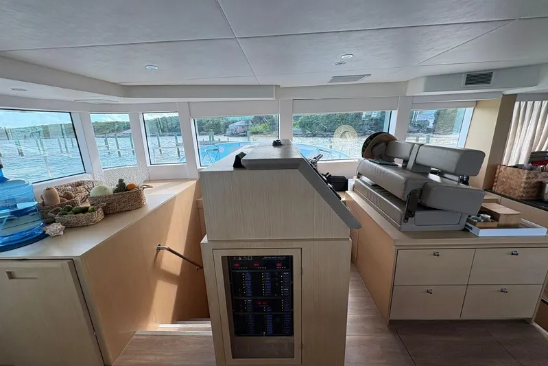 Silent Seven Yacht Photos Pics Interior of 2020 Silent 55 yacht with helm, seating, and panoramic windows.