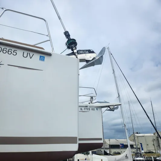 Skye Yacht Photos Pics 2023 Jeanneau Sun Odyssey 349 sailboats docked under cloudy sky.