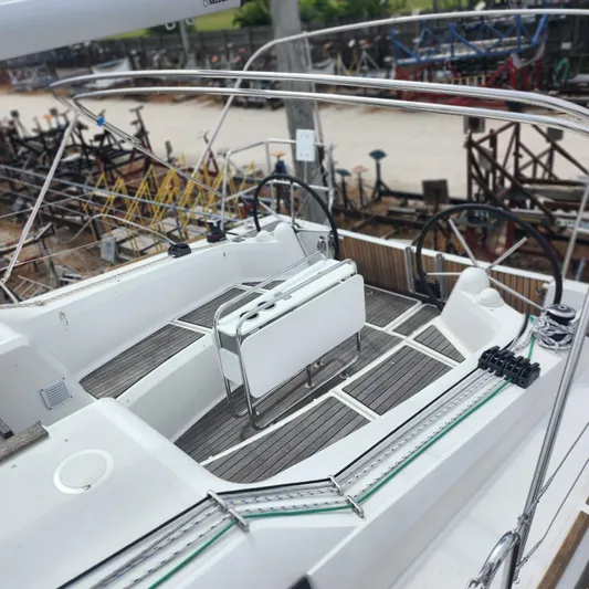 Skye Yacht Photos Pics 2023 Jeanneau Sun Odyssey 349 sailboat cockpit with dual steering wheels and teak flooring.