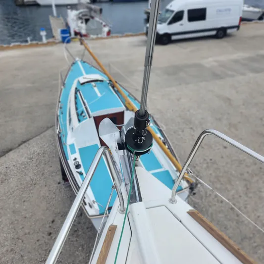 Skye Yacht Photos Pics 2023 Jeanneau Sun Odyssey 349 sailboat docked, viewed from above, with marina background.