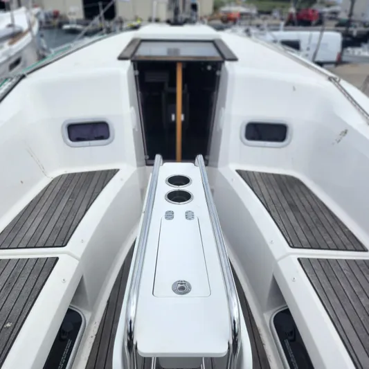 Skye Yacht Photos Pics 2023 Jeanneau Sun Odyssey 349 yacht cockpit with sleek design and wooden seating.