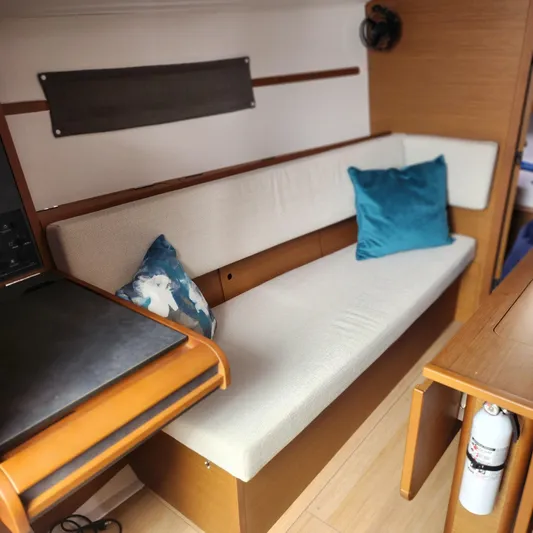 Skye Yacht Photos Pics Interior of 2023 Jeanneau Sun Odyssey 349 yacht with cozy seating and cushions.