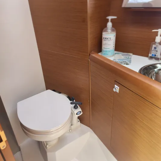 Skye Yacht Photos Pics 2023 Jeanneau Sun Odyssey 349 yacht bathroom with toilet and sink.