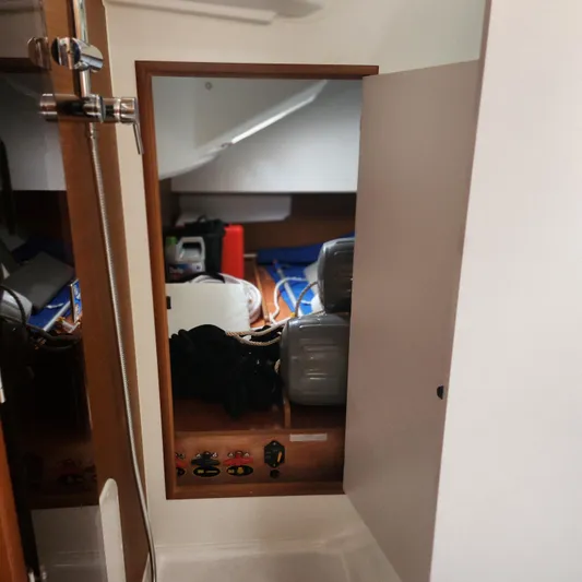 Skye Yacht Photos Pics Interior view of 2023 Jeanneau Sun Odyssey 349 sailboat storage compartment.